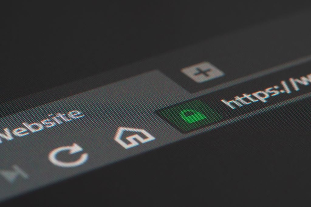 A close-up of a browser URL bar showing a secure connection with a green padlock icon and "https://" prefix.