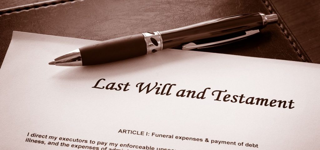 "Last Will and Testament" document with a pen.