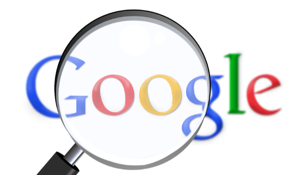 A magnified Google logo.