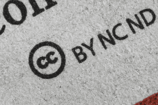 A close up of a surface with creative commons logo printed on it.